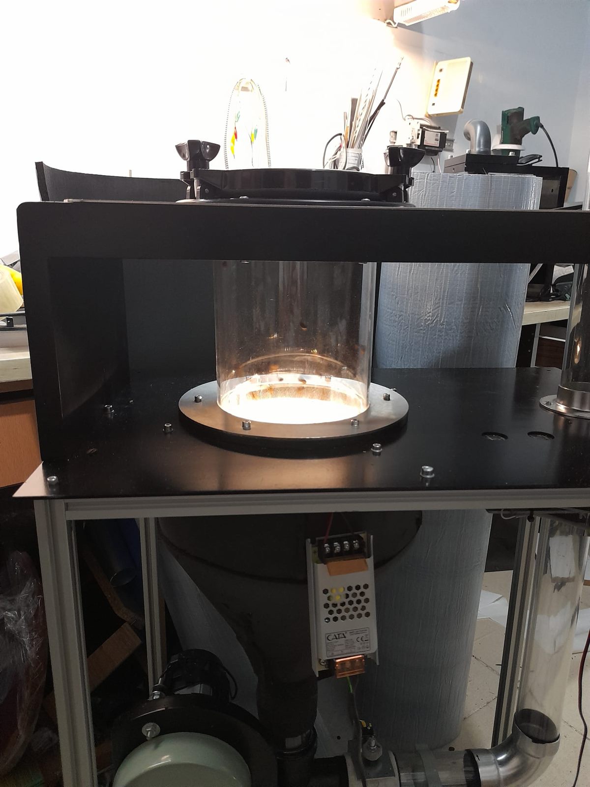 Illuminated clear cyclone chamber with coffee beans inside