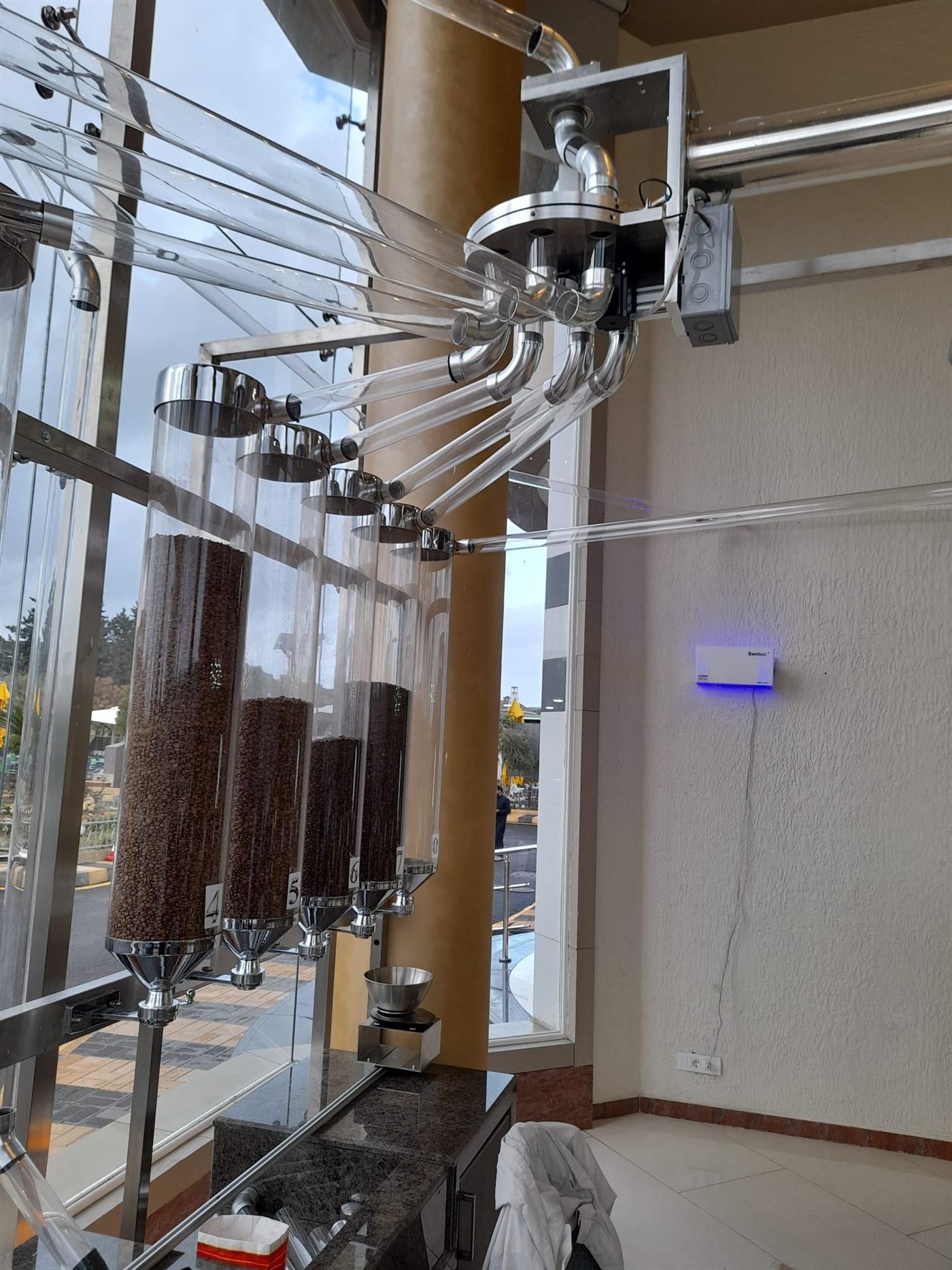 Close view of the stainless rotary distributor and acrylic pipe fan at Coffee Land
